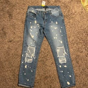Blue jeans with bleach distressing